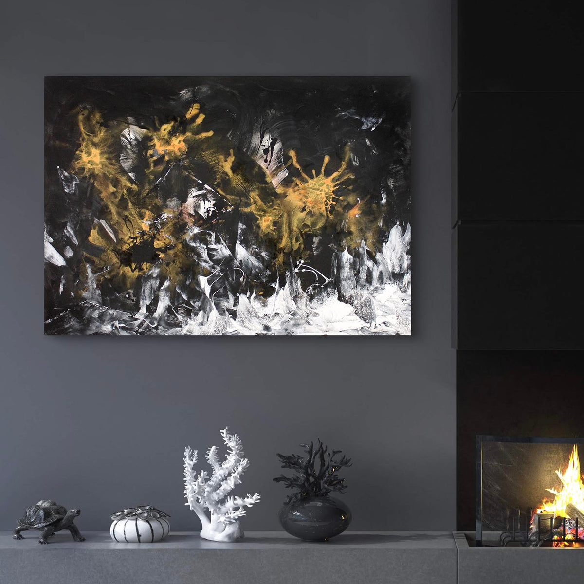 Abstract landscape painting featuring dynamic black, white, and golden brush strokes against a dark background, displayed on a wall in a cozy living space with a fireplace and decorative accents.