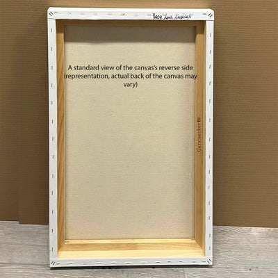 Large canvas art with white wooden frame in neutral room setting