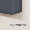 Edge of a painting on a wall with text 'Edge of the painting'.