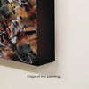 Typical edge of the Abstract painting with a black frame on a beige wall