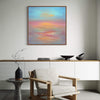 Abstract Seascape | Pearl Sunset 28x28" - Vibrant abstract painting depicting a stunning sunset over the ocean, displayed in a modern living room setting.