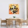 vibrant orange abstract wall art over sofa in dining room