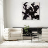 Echoes Of Power, original Black, Red, White abstract painting by Paresh Nrshinga displayed in a contemporary interior.