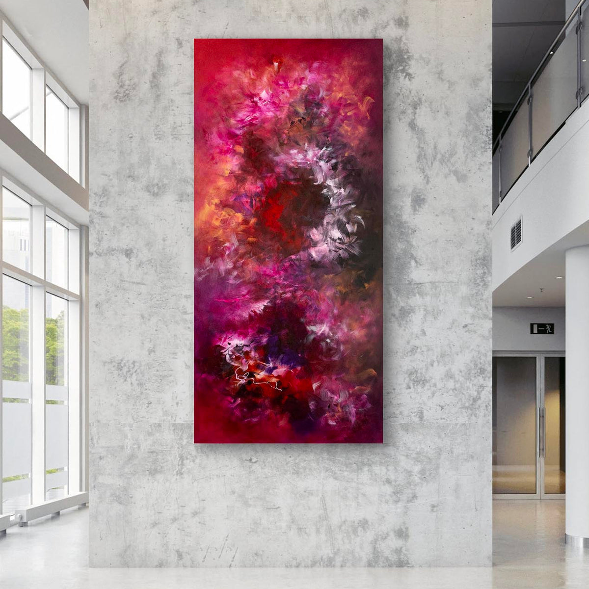 Vibrant Floral Artwork: Oversized abstract landscape painting with bold, vibrant colors of red, pink, and orange on display in a modern, minimalist interior setting.