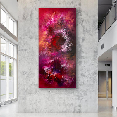 Vibrant Floral Artwork: Oversized abstract landscape painting with bold, vibrant colors of red, pink, and orange on display in a modern, minimalist interior setting.