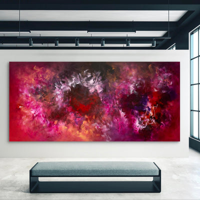 Large abstract art canvas with vibrant red, pink, and purple tones depicting a dynamic, expressive landscape. The artwork creates a bold, eye-catching focal point in the modern, minimalist interior setting.