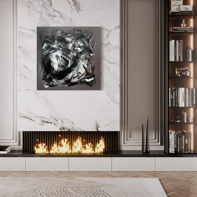 Dramatic black and white abstract painting on marble wall above modern fireplace with crackling flames, flanked by elegant bookshelves in stylish living room interior