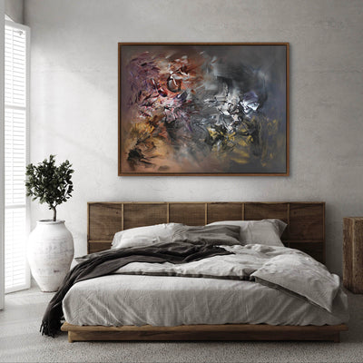 Large abstract painting featuring vibrant colors and dramatic brushstrokes displayed above a modern wooden bed frame in a minimalist bedroom setting.