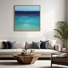 Abstract Seascape | Tranquil Waters 28x28" - Serene ocean landscape painting displayed on a white wall above a modern living room couch