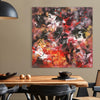 Large Abstract painting on a wall above a dining table with a lamp and decor items.