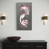 Abstract painting on a gray wall above a black console table with a bowl.