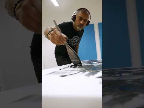 Contemporary artist Paresh Nrshinga in studio creating original abstract paintings, behind-the-scenes artistic process