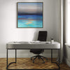Vibrant abstract seascape painting | Sunset Dream 36x36" hanging on the wall above a modern desk with a black office chair in a minimalist home office setting.