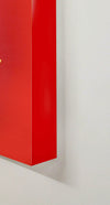 Vibrant red geometric abstract painting on white background
